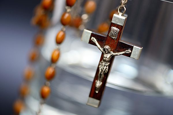 Glass of water and cross, euthanasia