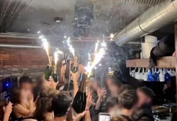 Crans-Montana: Flames engulfing the city and people fleeing after a deadly explosion during a New Year's Eve celebration.