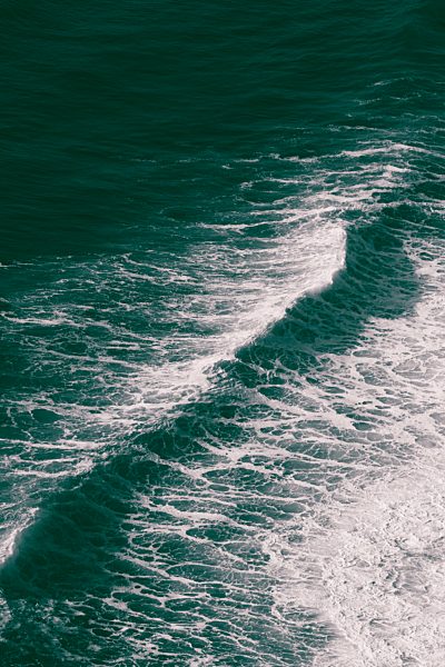 Overhead view of crashing wave and surf on the coast of Oregon