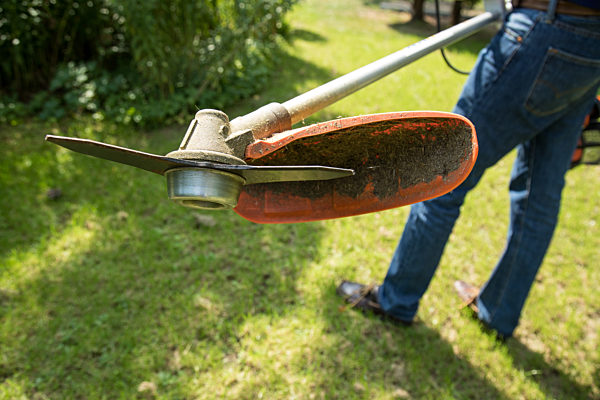 Brush cutter in the garden
