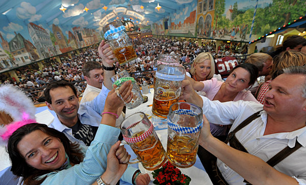 Beer litre tankards with colourful bands at the Oktoberfest
