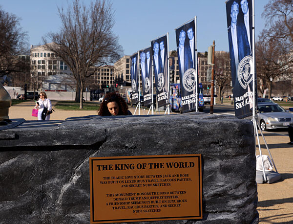 Jeffrey Epstein and US President Donald Trump statue in Washington, DC, USA.