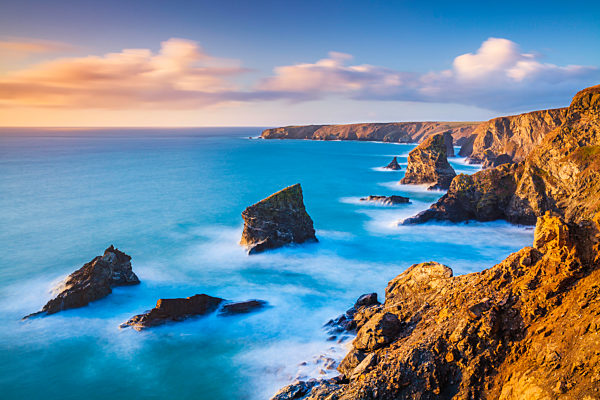 Sunset, Bedruthan steps Cornwall sea stacks at high tide Carnewas Bedruthan North Cornwall coast Cornwall England UK GB Europe