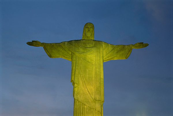 Floodlit statue of Christ the Redeemer at 710m on Mount Corcovado, above Rio de Janeiro, Brazil, South America