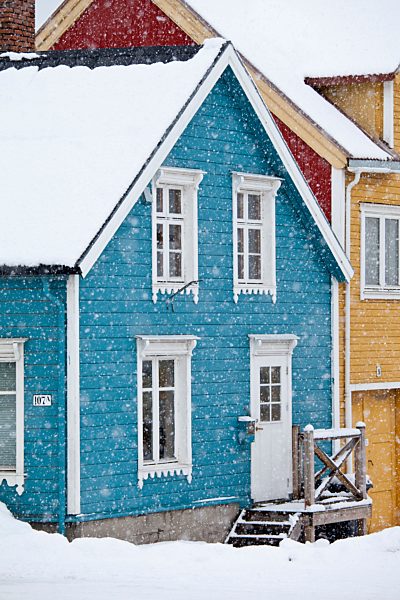 Traditional architecture wooden buildings along Storgata in the quaint area of the city of Tromso, in the Arctic Circle in Northern Norway