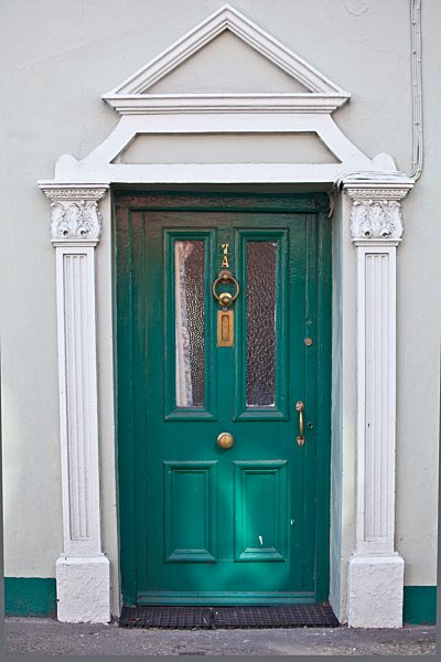 Brightly coloured turquoise door and Georgian style arch in Youghal, East Cork, County Cork, Southern Ireland