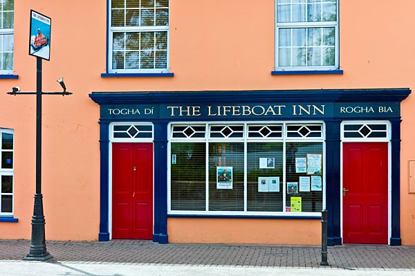 Brightly painted The Lifeboat Inn traditional bar in Courtmacsherry, West Cork, Ireland