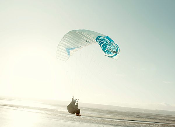 Paragliders soar over the Dee estuary, Wirral