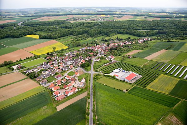 Village - view at the edge of fields in the district Eckartshausen in Werneck in the federal state Bavaria