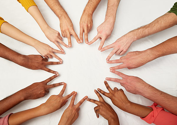 group of international people showing peace sign