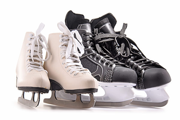 Ice hockey skates and figure skates isolated on white background.