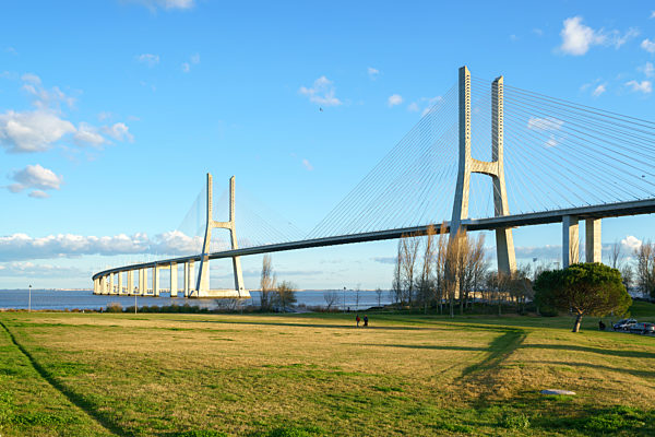 Ponte Vasco da Gama Bridge view from a garden park during the day