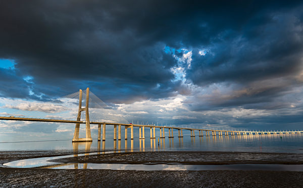 Vasco da Gama Bridge at sunset in Lisbon, Portugal
