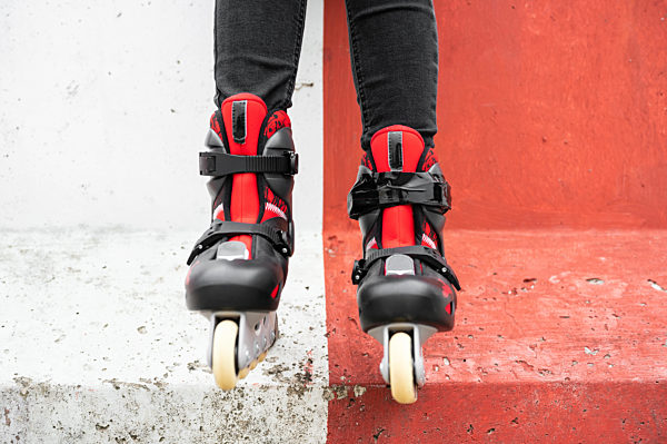Close-up Of Legs Wearing Roller Skating Shoe, Outdoors urban lifestyle portrait.