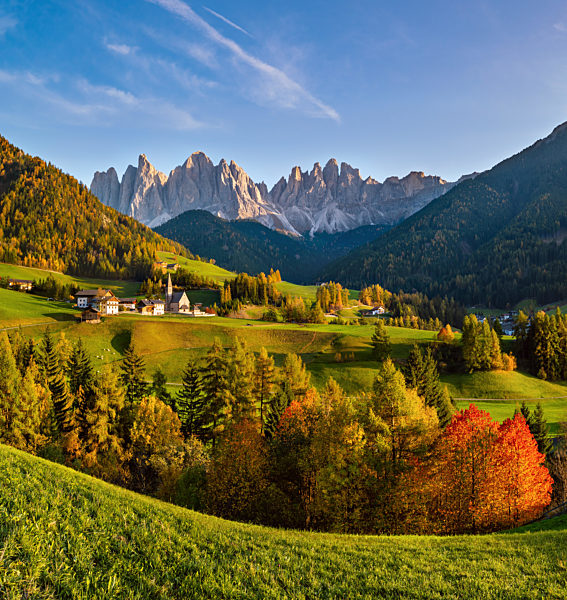 Autumn evening Santa Magdalena famous Italy Dolomites village view in front of the Geisler or Odle Dolomites mountain rocks.
