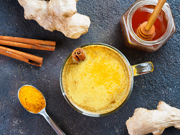 golden turmeric latte and ingredients, copy space