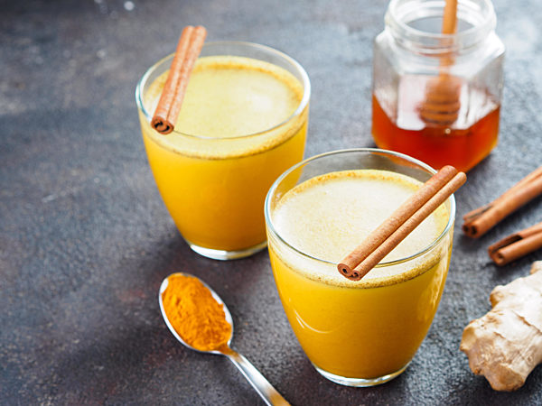 golden turmeric latte and ingredients, copy space