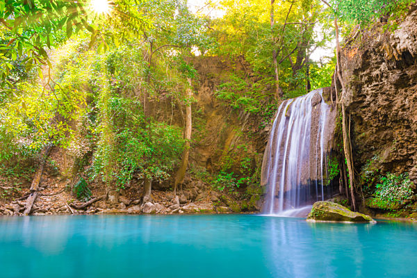 Beautiful waterfall in wild rainforest in Erawan National park, Thailand