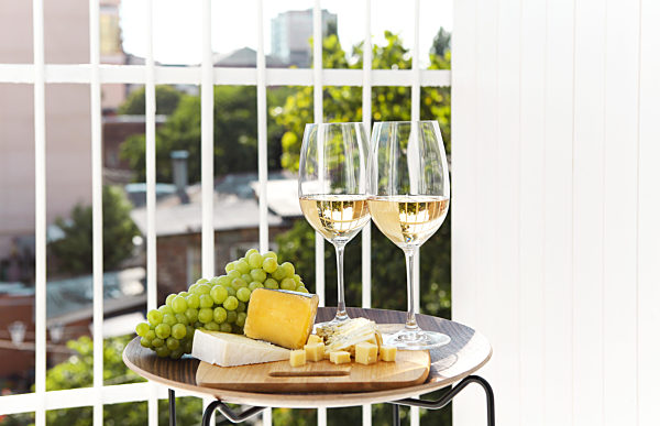 Wine with grapes and cheese on terrace