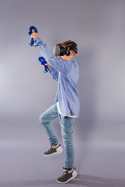 Teenager boy using the virtual reality glasses