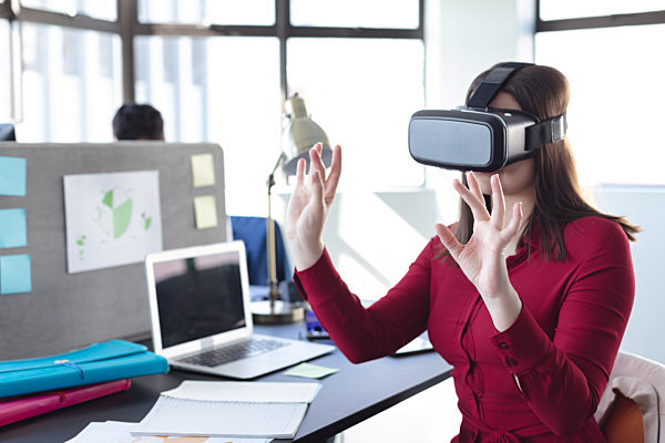 Business professional at work using VR