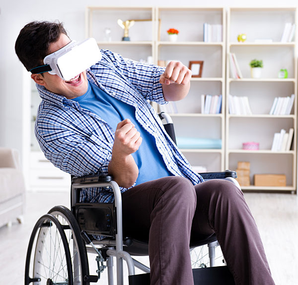 Disabled man studying with virtual reality glasses
