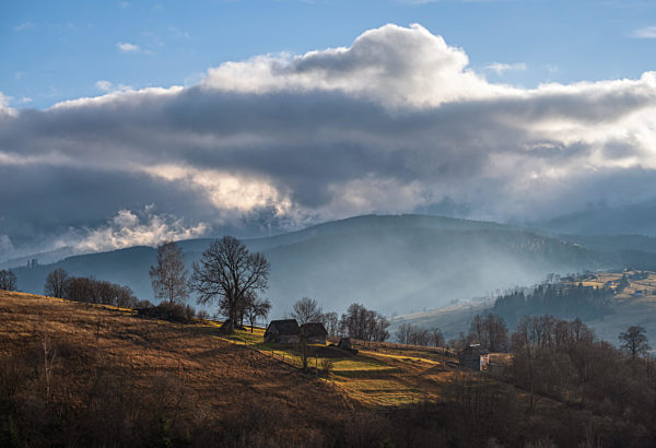 Picturesque morning above late autumn mountain countryside.  Ukraine, Carpathian Mountains. Peaceful traveling, seasonal, nature and countryside beauty concept scene.