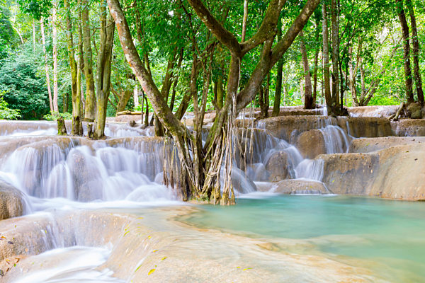 Laos Tad Sae Waterfall in the green forest, long exposure showing the nature of Laos, displaying soft water and tropical paradise, vivid colors