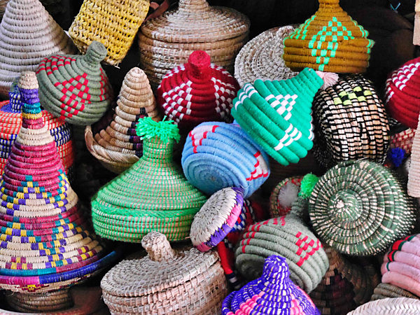 Selection of colourful wicker baskets on sale, Essaouira, Morocco