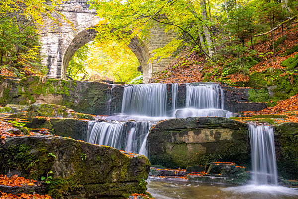 Old Stone Bridge and Forest Waterfall