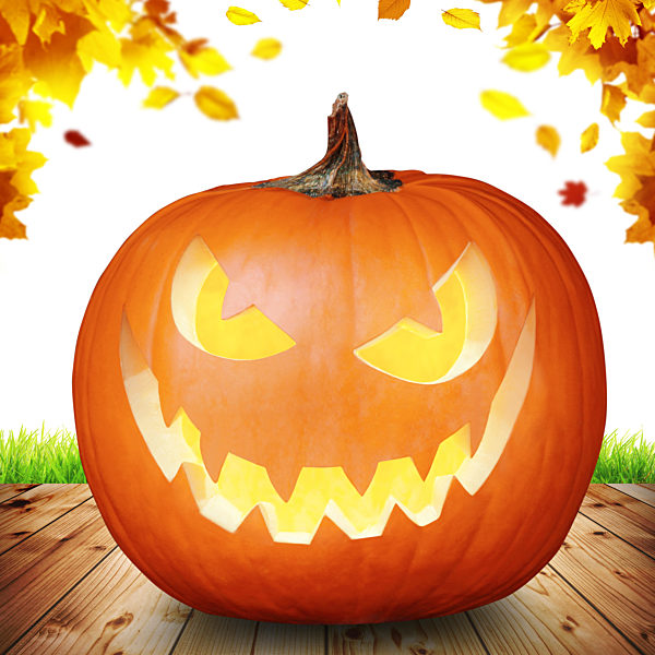 Scary Halloween pumpkin with eyes glowing inside on wooden background