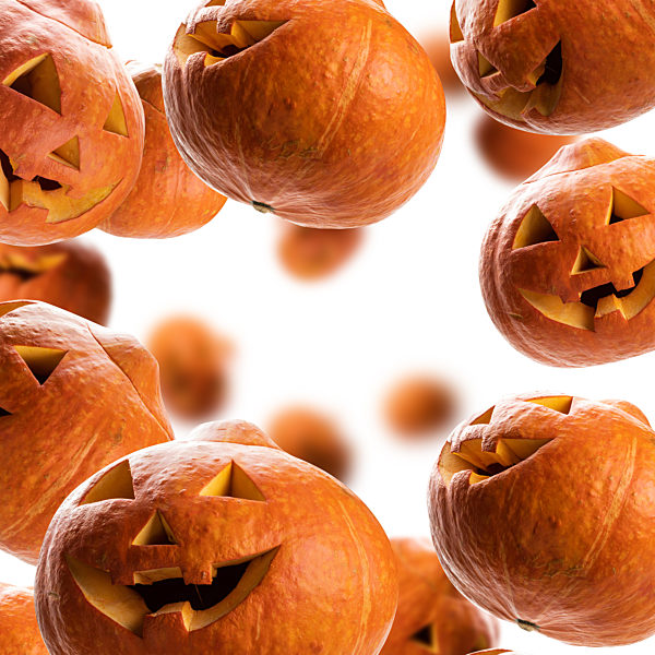 Glowing pumpkins levitate on a white background