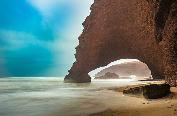 Red arches of Legzira beach, Morocco.