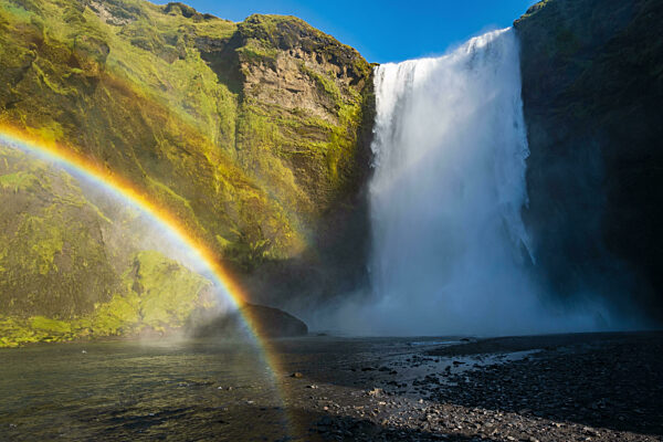 Picturesque full of water big waterfall Skogafoss autumn view, southwest Iceland.
