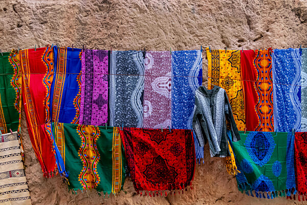 Colorful Clothing And Materials Are Sold In The Open Market In The City Of Fes, Morocco, Africa