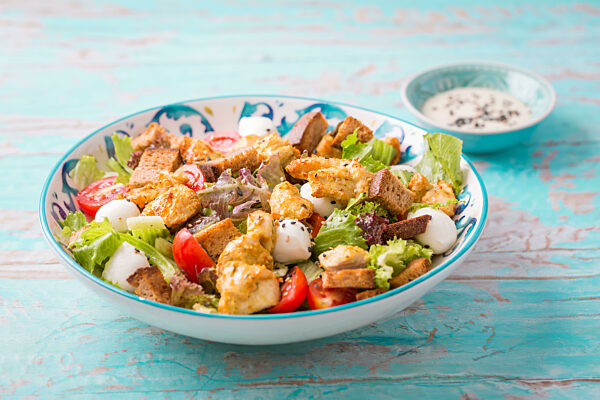 Healthy Grilled Chicken Caesar Salad with Cheese and Croutons