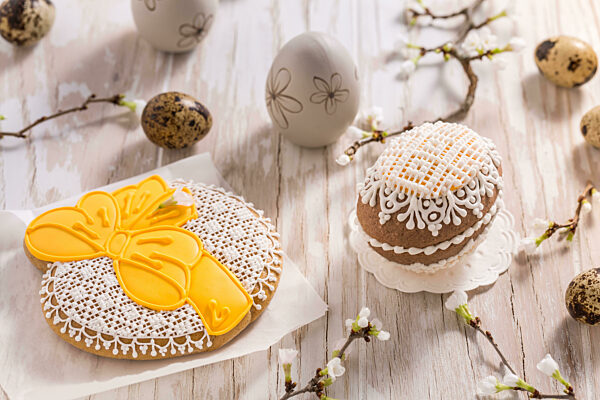 Easter egg gingerbread cookies with branches. Spring concept.