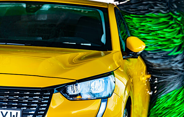 A motorcar in an automatic car wash.