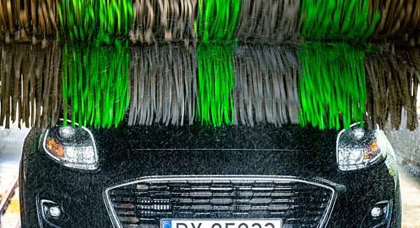 A motorcar in an automatic car wash.