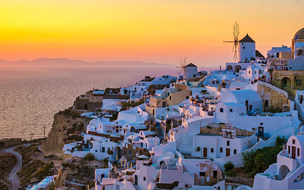 Sunset at the Greek village of Oia Santorini Greece with a view over the ocean caldera