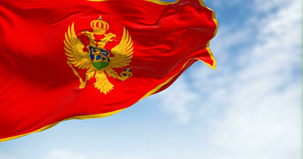 National flag of Montenegro waving in the wind on a clear day
