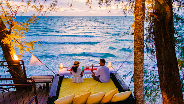 Romantic dinner on the beach in Koh Kood Thailand, couple having dinner on the beach during vacation