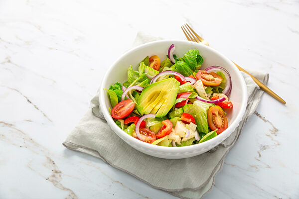 Healthy green salad with avocado
