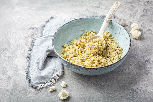 Roasted  organic cauliflower rice with herbs - paleo and ketogenic diet concept