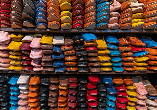 detail view of shelves full of colourful leather shoes and slippers in the medina of Fez near the Chouara Tannery