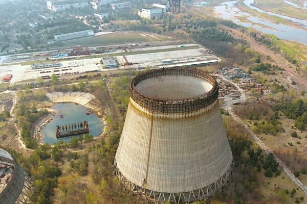 Drone flies over the cooling tower, top view