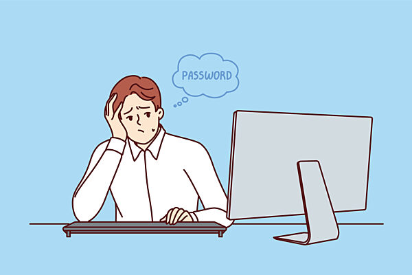 Geschäftsmann denkt sich ein Passwort aus, das persönliche Daten zuverlässig schützt, und setzt sich an den Tisch mit dem Computer