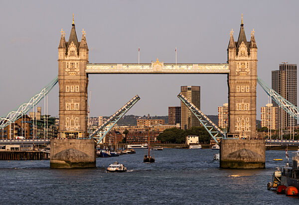 Tower Bridge, an iconic symbol of London, rising over the River Thames with...