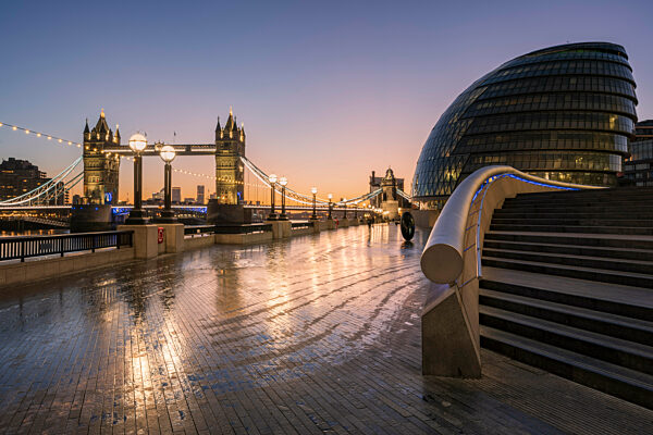 View of Tower Bridge from More London at dusk.