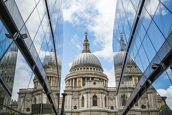 St Pauls Cathedral pictured between two modern facades in the heart of London.